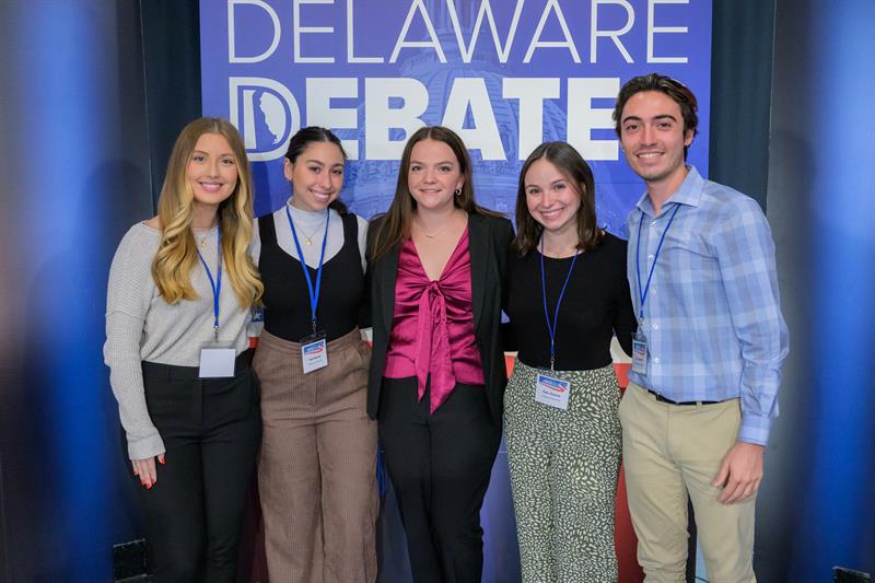Meg Roessler (center) and production assistants (from left) Serafina Carollo, Faith Bartell, Kate Zincone, and AJ Rubinetti celebrate a successful Delaware Debates program on Oct. 20.