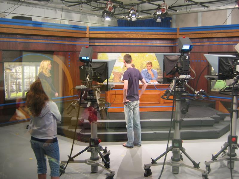 Students prepare for a news broadcast at the UD Student Television Network studio